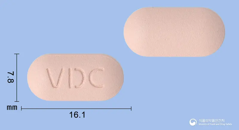 메디칼시움정 앞뒤 사진 (분홍색 장방형, 각인 VDC)