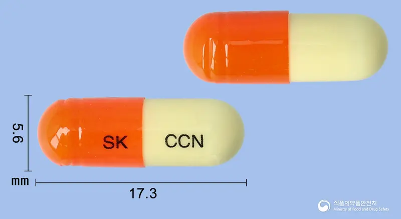 코코엔캡슐 앞뒤 사진 (주황색 캡슐, 각인 SK CCN)
