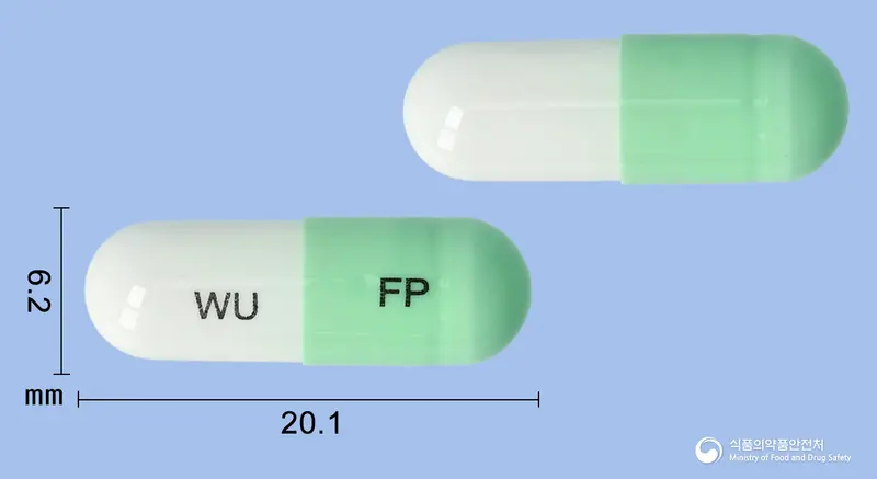 타스페노캡슐(피타바스타틴칼슘,페노피브레이트) 앞뒤 사진 (연두색 캡슐, 각인 WU FP)