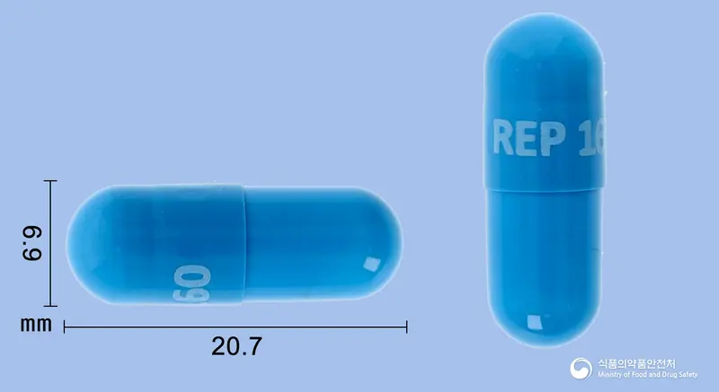 옥타이로캡슐160밀리그램(레포트렉티닙) 앞뒤 사진 (파란색 캡슐, 각인 REP 160)