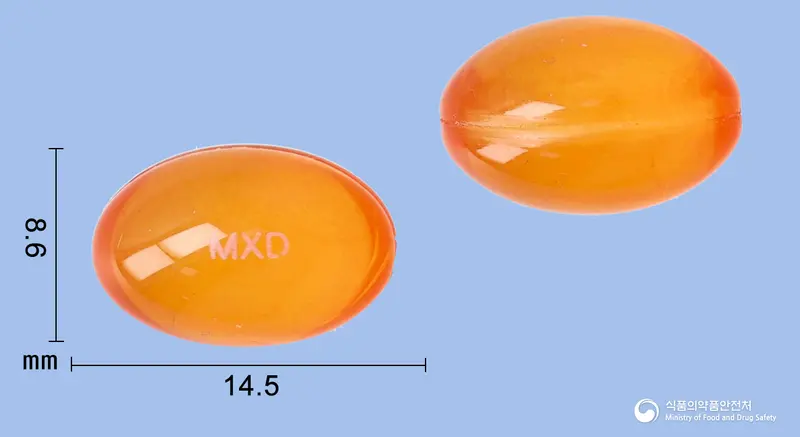 맥시부펜콜드연질캡슐 앞뒤 사진 (주황색·투명 캡슐, 각인 MXD)