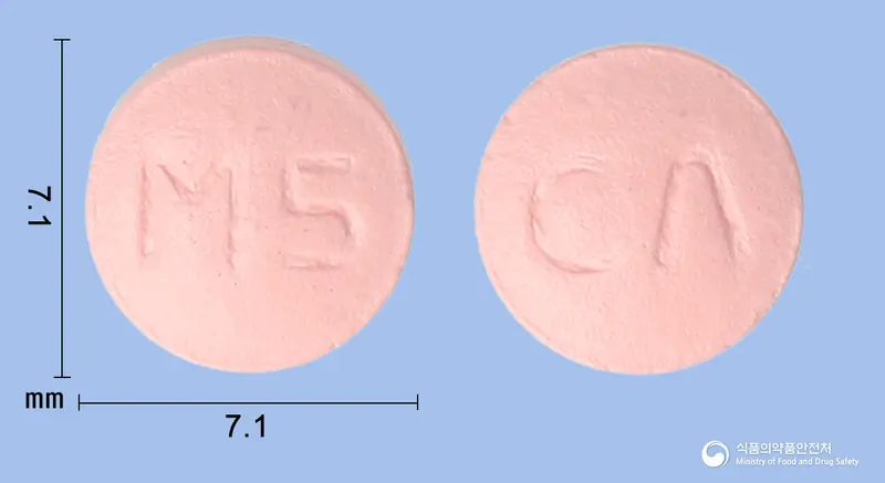 미그씬정(미그리톨) 앞뒤 사진 (분홍색 원형, 각인 M5 / CΛ)
