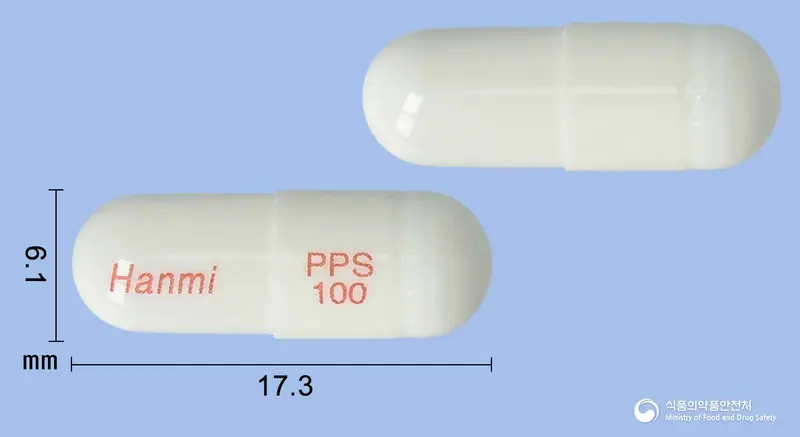 한미펜토산캡슐(펜토산폴리설페이트나트륨) 앞뒤 사진 (흰색 캡슐, 각인 Hanmi PPS 100)