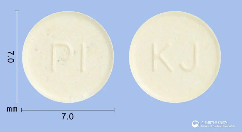 펠로펜정((펠루비프로펜(미분화)) 앞뒤 사진 (노란색 원형, 각인 PI / KJ)